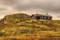 Cabin on hill in Hardangervidda National Park, Norway Royalty Free Stock Photo