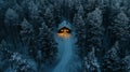 A Cabin Illuminated in a Snowy Forest at Night Royalty Free Stock Photo