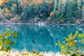 Cabin on the lake in the autumn forest in the mountains Royalty Free Stock Photo