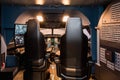 Cabin of a large airliner simulator. View of the cockpit and seats in the A320 airbus simulator Royalty Free Stock Photo