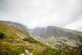 Cabin lift to the mountain. Mountain landscape in High Tatry. Chairlift at the ski resort in a cloud. Ski lift, cable car cabin in