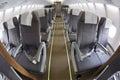 Cabin of modern passenger airplane. Aisle between seats Royalty Free Stock Photo