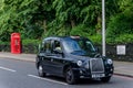 Cabin phone and taxi in London, June 2015. England / United Kingdom