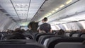 Cabin of the S7 airline, stewards carry water to passengers.