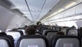 Cabin of the S7 airline, stewards carry water to passengers.