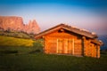 Cabin at Seiser Alm with Schlern mountain, South Tyrol, Italy Royalty Free Stock Photo