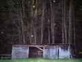 A cabin or stable in the woods