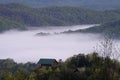 Smoky Mountain cabin surrounded by fog Royalty Free Stock Photo