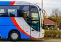 The cabin of a white, red and blue modern tour bus, transport for the travel industry Royalty Free Stock Photo