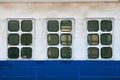 Cabin windows and portholes on outboard side of ship