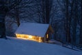 Cabin in the winter forest Royalty Free Stock Photo