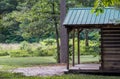 Cabin in the woods with a chipmunk on the porch