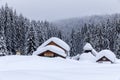 Cabin in the woods, a house covered in snow Royalty Free Stock Photo