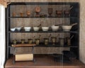 Cabinet full of mortars and pestles in Post Hospital at the Fort Davis National Historic Site in Fort Davis, Texas. Royalty Free Stock Photo