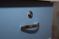 Cabinet handle silver with lock blue Royalty Free Stock Photo