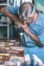 Cabinetmaker drilling wood in workbench