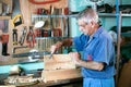 Cabinetmaker filing in the bench in garage at home