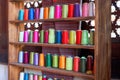 The cabinets of the Chinese tailor shop are filled with cotton thread spools of various colors Royalty Free Stock Photo