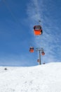 Cabins of cable car against blue sky Royalty Free Stock Photo