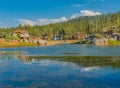 Cabins reflect into the Back bay of Boulder Bay, Big Bear Lake, California Royalty Free Stock Photo