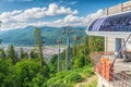 Cablaway with cable car arriving on top of mountain