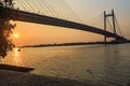 Cable bridge Vidyasagar Setu on the river Hooghly at sunset Silhouette view