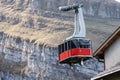 Cable car on the background of a rocky hillside, Toggenburg