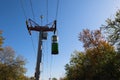 Cable car with colored cabins in autumn.