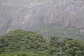 Cable car construction tower on the forest between deforestation on girnar mountain. Royalty Free Stock Photo