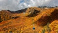 A cable car flying over the beautiful autumn valley in Tateyama Kurobe Alpine Route, Toyama, Japan Royalty Free Stock Photo