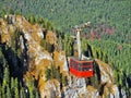 Cable car at high altitude - rocky cliffs- Postavaru peak,Poiana Brasov, Romania, Transylvania - Carpathian mountains. Telecabina Royalty Free Stock Photo