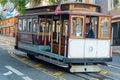 Cable car in historic districts in san francisco california deep in heart of city with white color and wooden accents Royalty Free Stock Photo