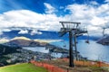Cable car lift for luge riders and view of Wakatipu lake and Queenstown