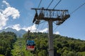 Cable car lifts tourists to the mountains in the year-round resort of Krasnaya Polyana. Krasnodar region, Sochi, Mountain Carousel