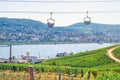 Cable car on rope of cableway from Rudesheim am Rhein town to Roseneck mount above vineyards fields Royalty Free Stock Photo