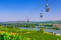 Cable car on rope of cableway from Rudesheim am Rhein town to Roseneck mount above vineyards fields Royalty Free Stock Photo