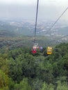 The cable car running down above the forest Royalty Free Stock Photo