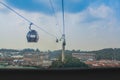 Cable car on Sentosa Island Singapore is over the sea, which is an important shipping port of Southeast Asia Royalty Free Stock Photo