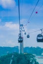 Cable car on Sentosa Island Singapore is over the sea, which is an important shipping port of Southeast Asia Royalty Free Stock Photo