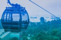 Cable car on Sentosa Island Singapore is over the sea, which is an important shipping port of Southeast Asia Royalty Free Stock Photo