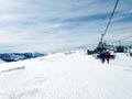 Cable car ski slope chairlift mountains Eastern Pyrenees, Andorra, sunny winter day, blue sky Royalty Free Stock Photo