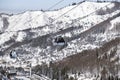 Cable car way on snowy mountains background. Gondola lift in winter mountains. Royalty Free Stock Photo