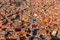 Cable cars or funicular system over orange roofs and buildings of the Bolivian capital, La Paz, Bolivia Royalty Free Stock Photo