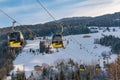 Yellow cable cars, gondola of the Planai West in Planai & Hochwurzen - skiing heart of the Schladming-Dachstein, Styria, Austria