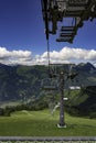 Cable chair pylon in a landscape with mountains and sky with white clouds