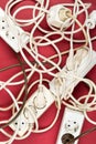 Cable chaos clutter from multiple electric wire extension cords Royalty Free Stock Photo