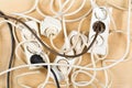 Cable chaos clutter from multiple electric wire extension cords Royalty Free Stock Photo