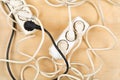 Cable chaos clutter from multiple electric wire extension cords Royalty Free Stock Photo