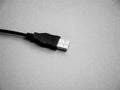 Cable connector USB on grey desk. Royalty Free Stock Photo