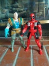 Cable & Deadpool toys on bricks in front of the fireplace Royalty Free Stock Photo